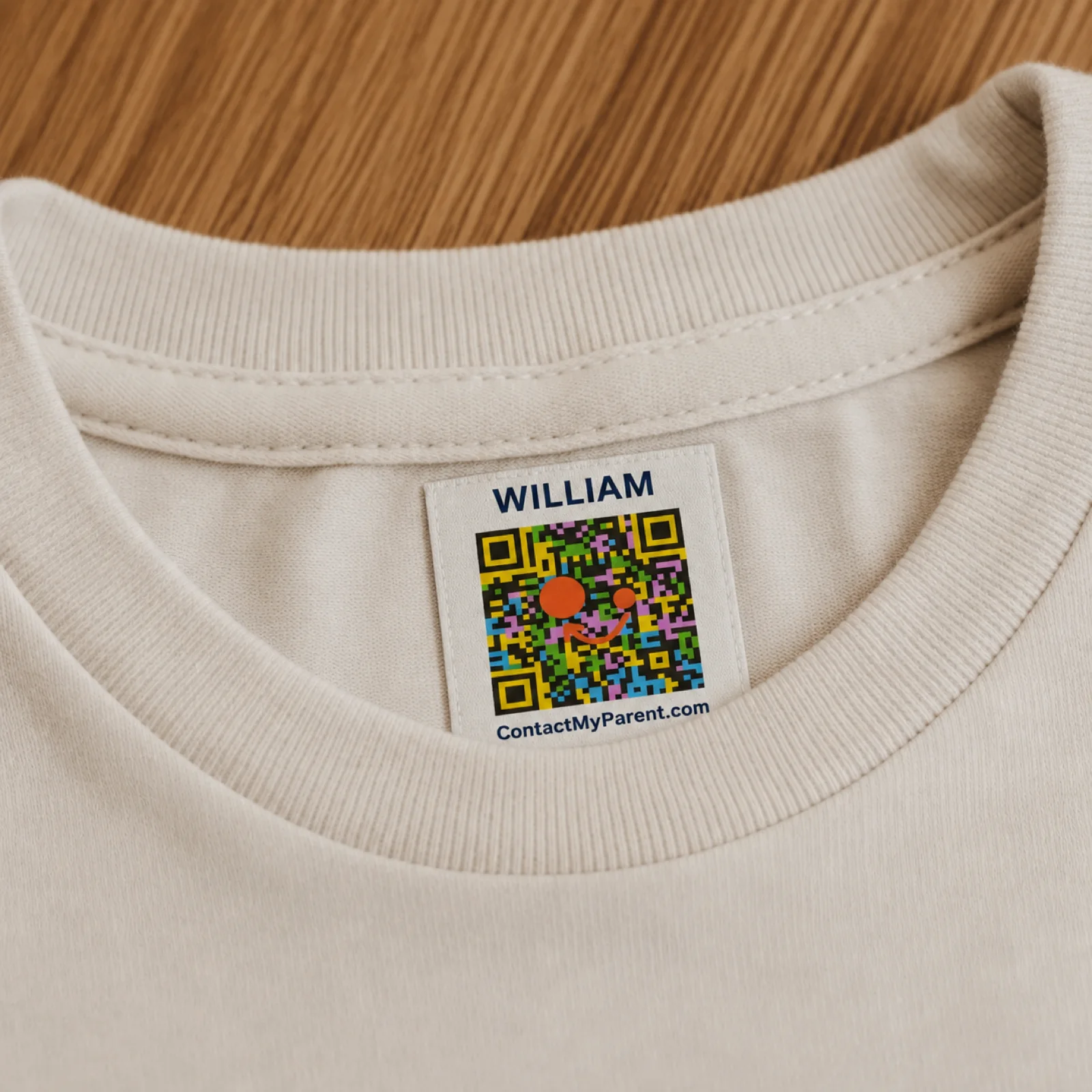 QR code safety label inside a child's t-shirt collar showing how ContactMyParent works